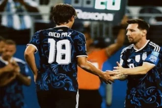 Gelandang Nico Paz dan Lionel Messi.